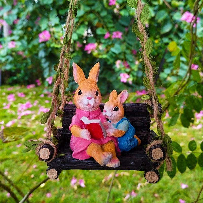 Simulated rabbit reading animal ornament