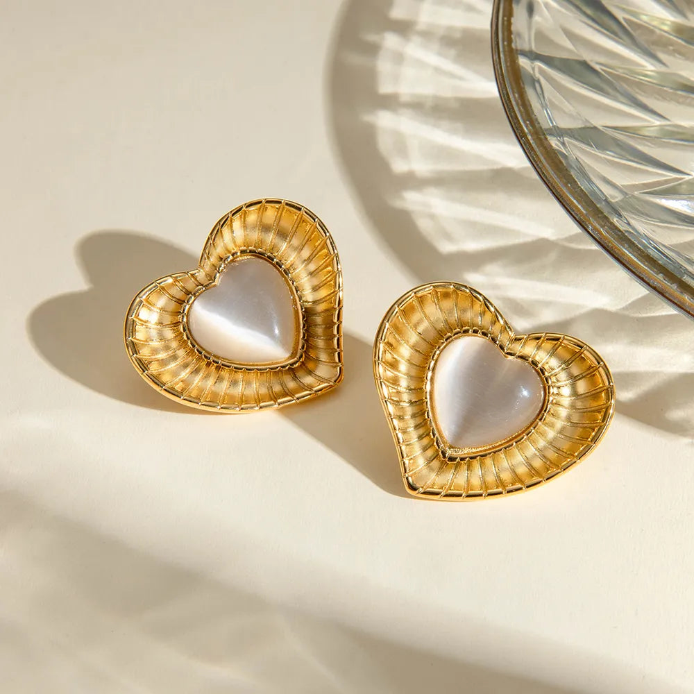 White cat eye stone earrings with niche temperament titanium steel earrings